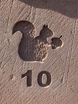 Close-up of Lithomex carved out squirrel logo